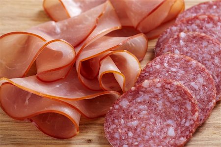 simsearch:400-06207145,k - salami sausage and ham on wooden cutting board Stock Photo - Budget Royalty-Free & Subscription, Code: 400-04369586