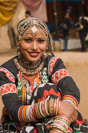 simsearch:400-05146135,k - Beautiful Kalbelia dancer in ornate black costume trimmed with beads and sequins at the Sarujkund Fair near Delhi in India. Stock Photo - Budget Royalty-Free & Subscription, Code: 400-04361128