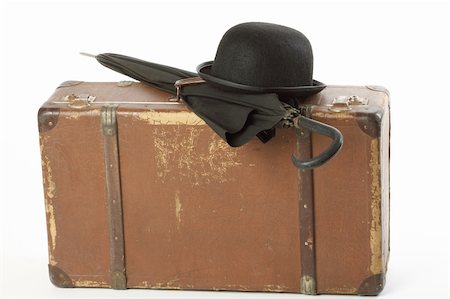 suitcase old - Old suitcase, bowler hat and umbrella over white Stock Photo - Budget Royalty-Free & Subscription, Code: 400-04376663