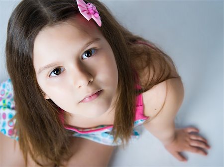 Beautiful little girl. Isolated on a white background Stock Photo - Budget Royalty-Free & Subscription, Code: 400-04377271