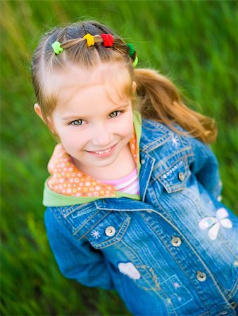 Cute little girl  on the meadow in spring day Foto de stock - Super Valor sin royalties y Suscripción, Código: 400-04377353