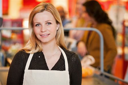 Portrait of a shop owner in the cashier area of the store Stock Photo - Budget Royalty-Free & Subscription, Code: 400-04379092