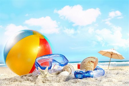 Fun day at the beach with goggles and beach ball Stock Photo - Budget Royalty-Free & Subscription, Code: 400-04379852