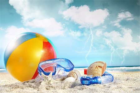 Fun day at the beach with storm approaching Stock Photo - Budget Royalty-Free & Subscription, Code: 400-04379853