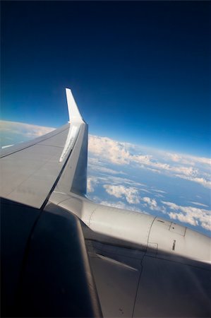 airplane flying high in the sky Stock Photo - Budget Royalty-Free & Subscription, Code: 400-04370608