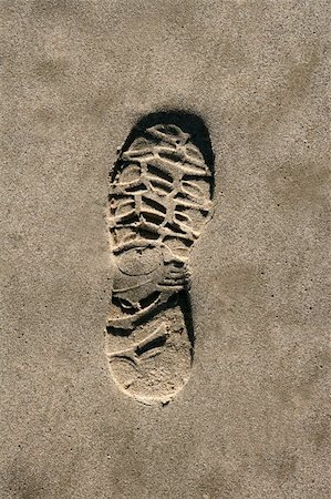 footprint shoe on beach brown sand texture print high view Stock Photo - Budget Royalty-Free & Subscription, Code: 400-04370951