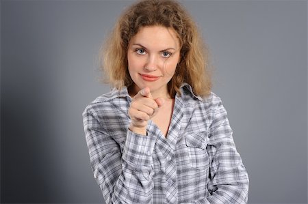 active woman pointing at you, on a grey  background Photographie de stock - Aubaine LD & Abonnement, Code: 400-04372167