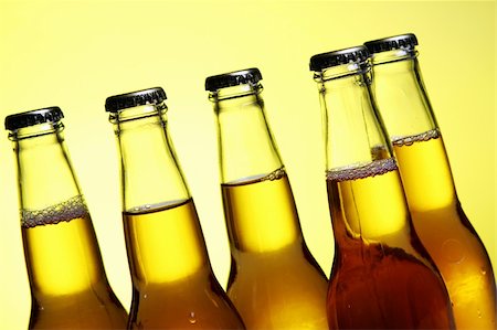 simsearch:400-04083275,k - Bottles of cold and fresh beer with ice over yellow background Stock Photo - Budget Royalty-Free & Subscription, Code: 400-04384963