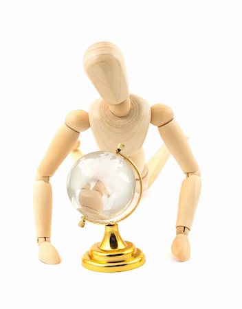 Wooden dummy and glass earth globe on white background Stock Photo - Budget Royalty-Free & Subscription, Code: 400-04385999