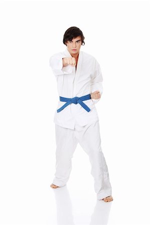 simsearch:400-04347301,k - Karate. Man in a kimono , isolated on the white background Photographie de stock - Aubaine LD & Abonnement, Code: 400-04389835