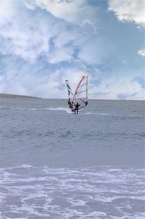 simsearch:400-03992760,k - two surfers windsurfing in the maharees in county kerry ireland during a storm coming close to each other making the shape of a butterfly Stock Photo - Budget Royalty-Free & Subscription, Code: 400-04380268