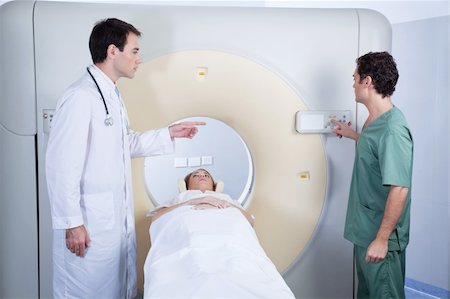 Doctor giving instructions to technician for carrying out MRI scan Stock Photo - Budget Royalty-Free & Subscription, Code: 400-04381737