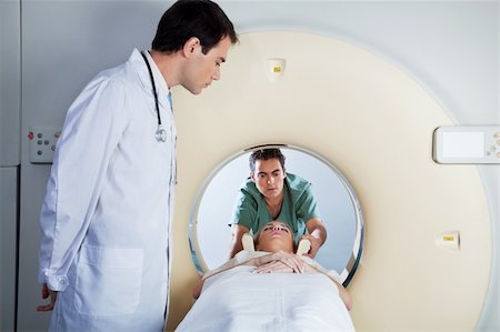 Doctor assisting the MRI scan with the technician in the laboratory Stock Photo - Budget Royalty-Free & Subscription, Code: 400-04381738