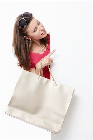 simsearch:400-05708287,k - Attractive young girl with a bag, and billboards Stock Photo - Budget Royalty-Free & Subscription, Code: 400-04395948