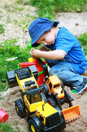 simsearch:400-04423521,k - Cute boy playing with digger at the playground Photographie de stock - Aubaine LD & Abonnement, Code: 400-04396062
