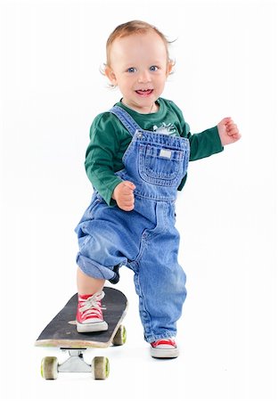 Cute 1 years old boy on a skateboard in the studio Stock Photo - Budget Royalty-Free & Subscription, Code: 400-04396584