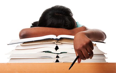Student tired of doing homework studying with pen asleep on open books, isolated. Stock Photo - Budget Royalty-Free & Subscription, Code: 400-04398791