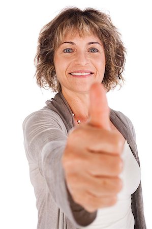 Confident senior woman gesturing thumbs-up isolated over white. Photographie de stock - Aubaine LD & Abonnement, Code: 400-04398972