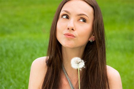 simsearch:400-04399510,k - Girl with dandelion on the green field Stock Photo - Budget Royalty-Free & Subscription, Code: 400-04399492