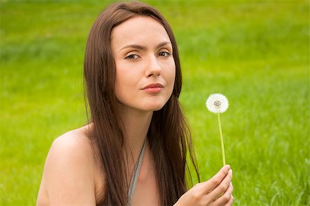 simsearch:400-04399510,k - Girl with dandelion on green field Stock Photo - Budget Royalty-Free & Subscription, Code: 400-04399504