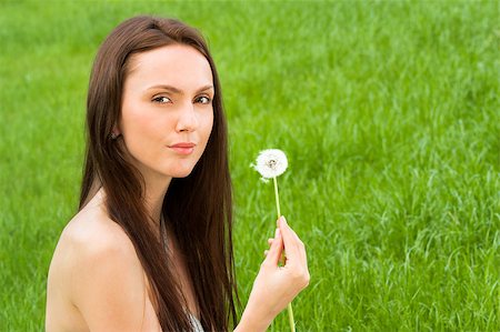 simsearch:400-04399510,k - Girl with dandelion on the green field Stock Photo - Budget Royalty-Free & Subscription, Code: 400-04399514