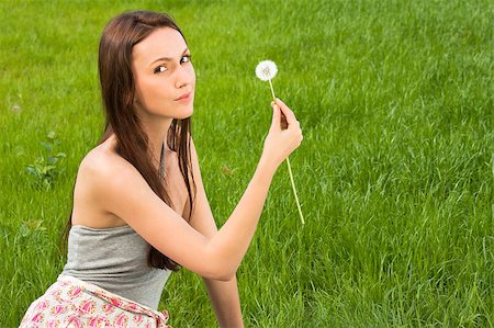 simsearch:400-04399510,k - Girl with dandelion on the green field Stock Photo - Budget Royalty-Free & Subscription, Code: 400-04399515