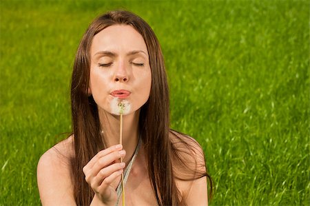 simsearch:400-04399510,k - Girl with dandelion on green field Stock Photo - Budget Royalty-Free & Subscription, Code: 400-04399517