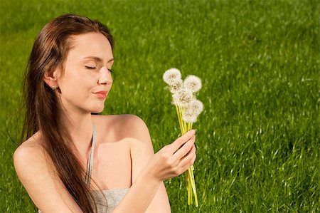 simsearch:400-04399510,k - Girl with dandelions on green field Stock Photo - Budget Royalty-Free & Subscription, Code: 400-04399519