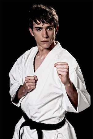 simsearch:400-04347301,k - Karate male fighter young high contrast on black background Photographie de stock - Aubaine LD & Abonnement, Code: 400-04392330