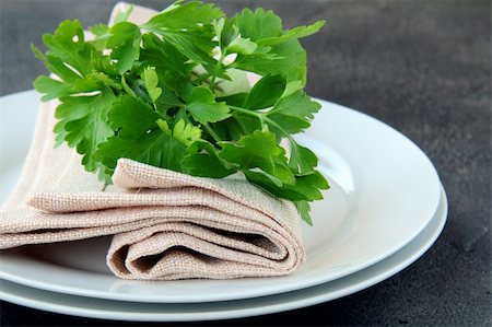 simsearch:400-08786053,k - plates with a linen napkin and a sprig of parsley - organic menu Stock Photo - Budget Royalty-Free & Subscription, Code: 400-04393246