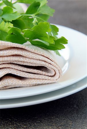 simsearch:400-08786053,k - plates with a linen napkin and a sprig of parsley - organic menu Stock Photo - Budget Royalty-Free & Subscription, Code: 400-04393247