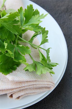 simsearch:400-08786053,k - plates with a linen napkin and a sprig of parsley - organic menu Stock Photo - Budget Royalty-Free & Subscription, Code: 400-04393713