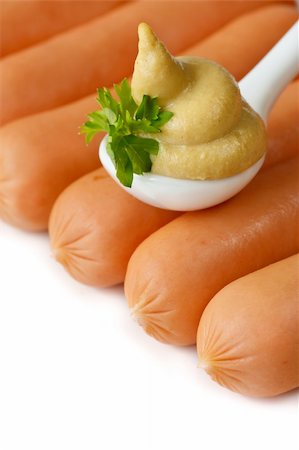 simsearch:400-04587885,k - Tasty sausages and spicy mustard in a ceramic spoon. Stock Photo - Budget Royalty-Free & Subscription, Code: 400-04393776