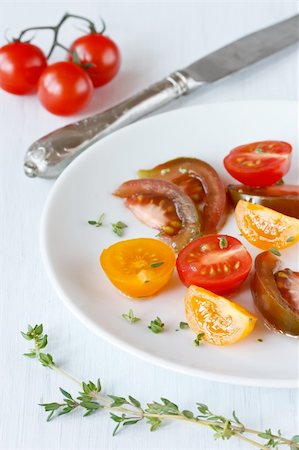 simsearch:400-05370250,k - Colorful tomatoes salad with thyme on a white plate. Stock Photo - Budget Royalty-Free & Subscription, Code: 400-04393832