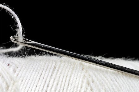 simsearch:6109-08701535,k - macro shot of needle and thread over black background Stock Photo - Budget Royalty-Free & Subscription, Code: 400-04404993