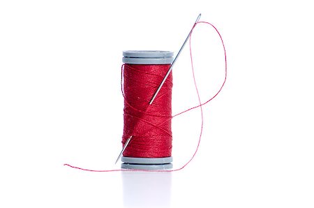simsearch:6109-08701535,k - Red thread bobbin and needle on white background. Stock Photo - Budget Royalty-Free & Subscription, Code: 400-04405281