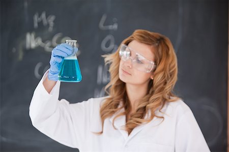 simsearch:400-09011632,k - Female scientist looking at a flask in a laboratory Stock Photo - Budget Royalty-Free & Subscription, Code: 400-04405517