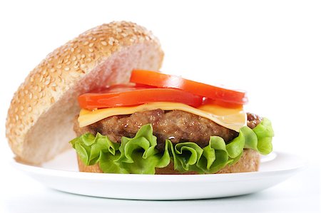 simsearch:400-06090558,k - Cheeseburger with tomatoes and lettuce isolated on white Stock Photo - Budget Royalty-Free & Subscription, Code: 400-04406557