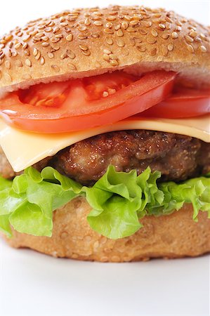 simsearch:400-06090558,k - Cheeseburger with tomatoes and lettuce isolated on white Stock Photo - Budget Royalty-Free & Subscription, Code: 400-04406567