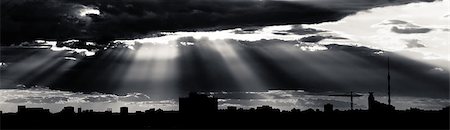 Black and white dramatic cloudscape with rays of light piercing through the clouds. Foto de stock - Super Valor sin royalties y Suscripción, Código: 400-04407116