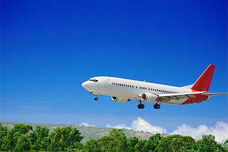 Large jet passenger airplane approaching for landing Stock Photo - Budget Royalty-Free & Subscription, Code: 400-04408064