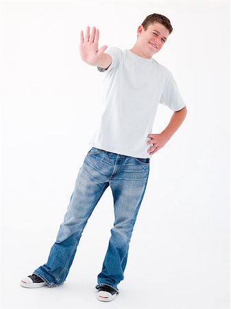simsearch:400-04402256,k - Teenage boy standing with hand up Stock Photo - Budget Royalty-Free & Subscription, Code: 400-04402217