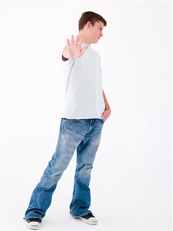 simsearch:400-04402256,k - Teenage boy standing with hand up Stock Photo - Budget Royalty-Free & Subscription, Code: 400-04402218