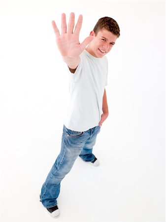 simsearch:400-04402256,k - Teenage boy standing with hand up smiling Stock Photo - Budget Royalty-Free & Subscription, Code: 400-04402221