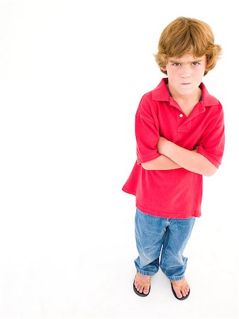 simsearch:400-04402256,k - Young boy with arms crossed scowling Stock Photo - Budget Royalty-Free & Subscription, Code: 400-04402347