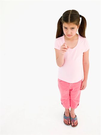 simsearch:400-04402256,k - Young girl pointing and frowning Stock Photo - Budget Royalty-Free & Subscription, Code: 400-04402349