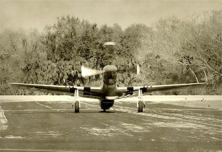 World War II era fighter airplane taxiing for takeoff Stock Photo - Budget Royalty-Free & Subscription, Code: 400-04403591