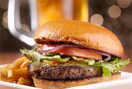 simsearch:400-06090558,k - gourmet cheeseburger with mug of beer in background Stock Photo - Budget Royalty-Free & Subscription, Code: 400-04414306