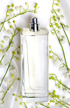 flower sale - Lily of the valley and perfume bottle on white silk Stock Photo - Budget Royalty-Free & Subscription, Code: 400-04414641