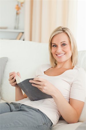 simsearch:400-04418460,k - Portrait of a smiling woman with a book looking at the camera Stock Photo - Budget Royalty-Free & Subscription, Code: 400-04418463